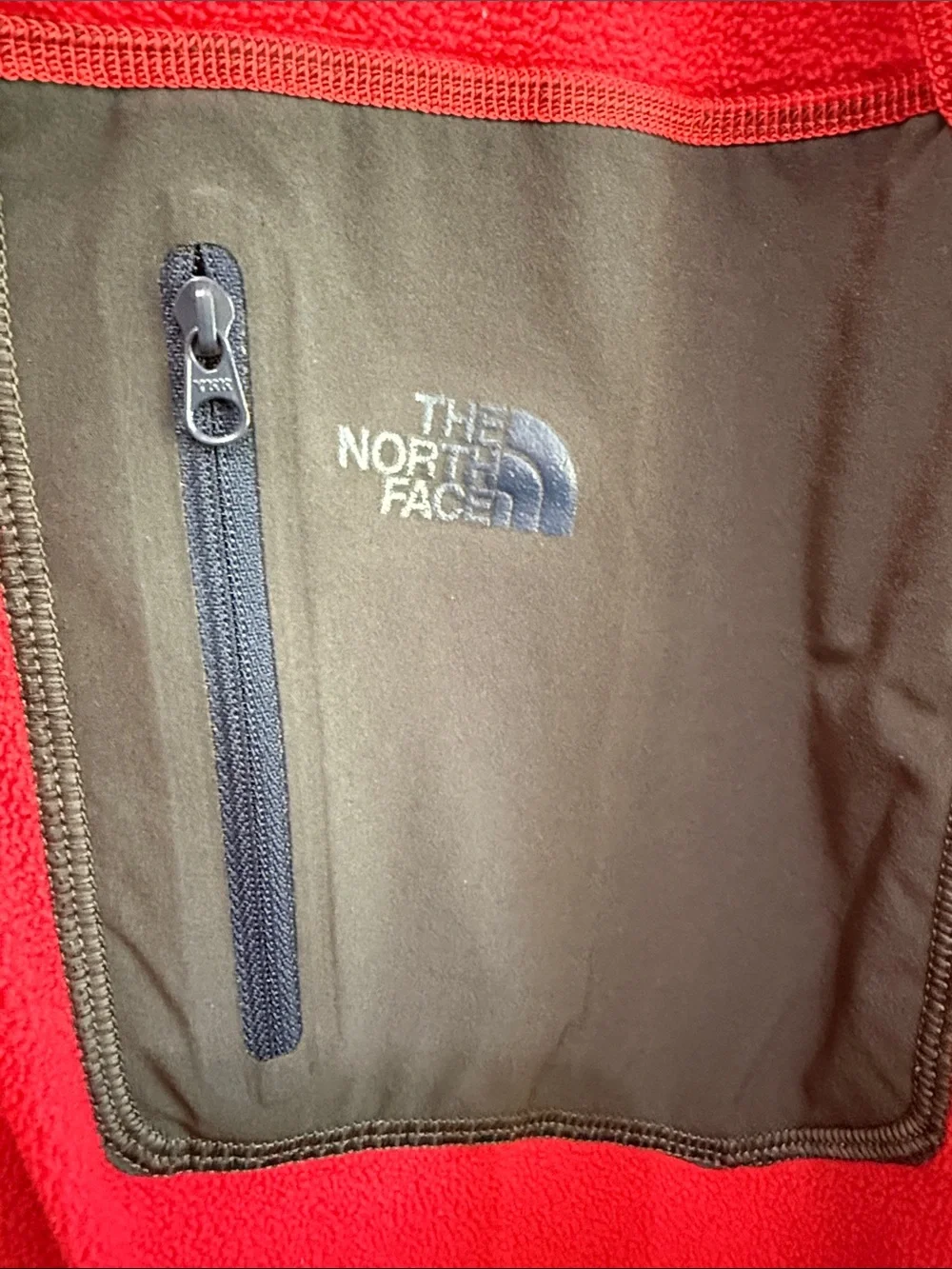 The North Face Men’s Red Lightweight Fleece Pullover with Black Chest Pocket